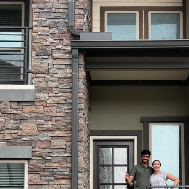 Avery's clients celebrating outside their new home